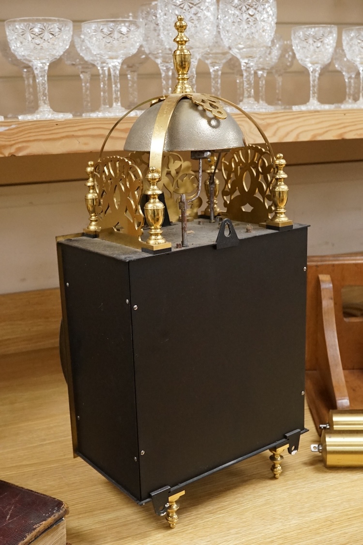 A large lantern style wall clock, 60cm high